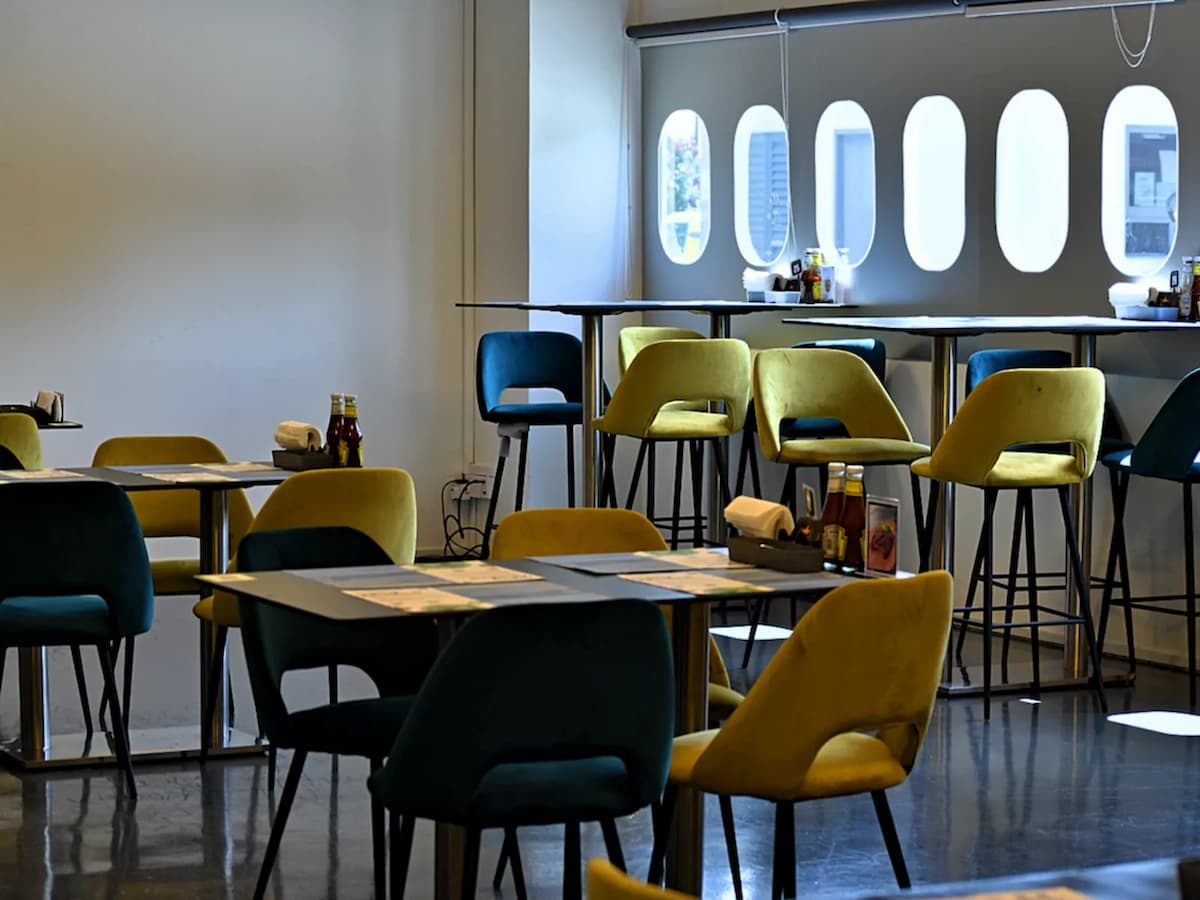 private event space with yellow black furniture setup