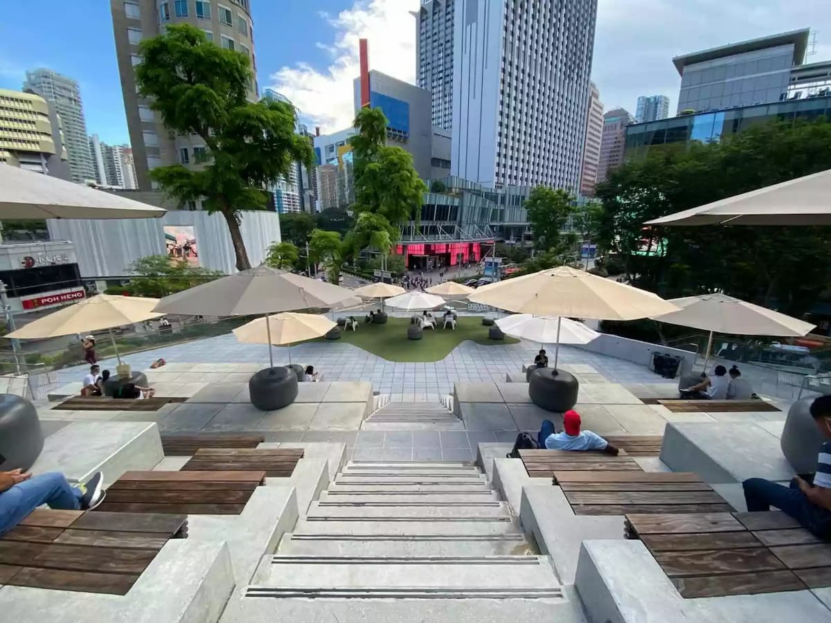 top view of a packed ampitheatre overlooking event space buildings in Singapore
