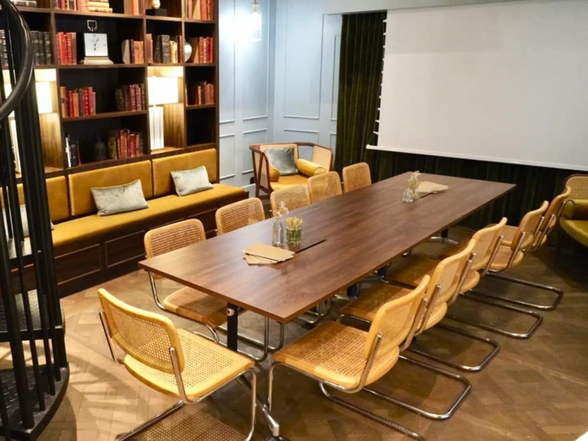 side view of a long meeting table in a library meeting room