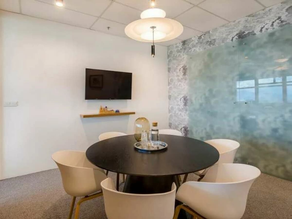 small meeting room with modern round table and chairs