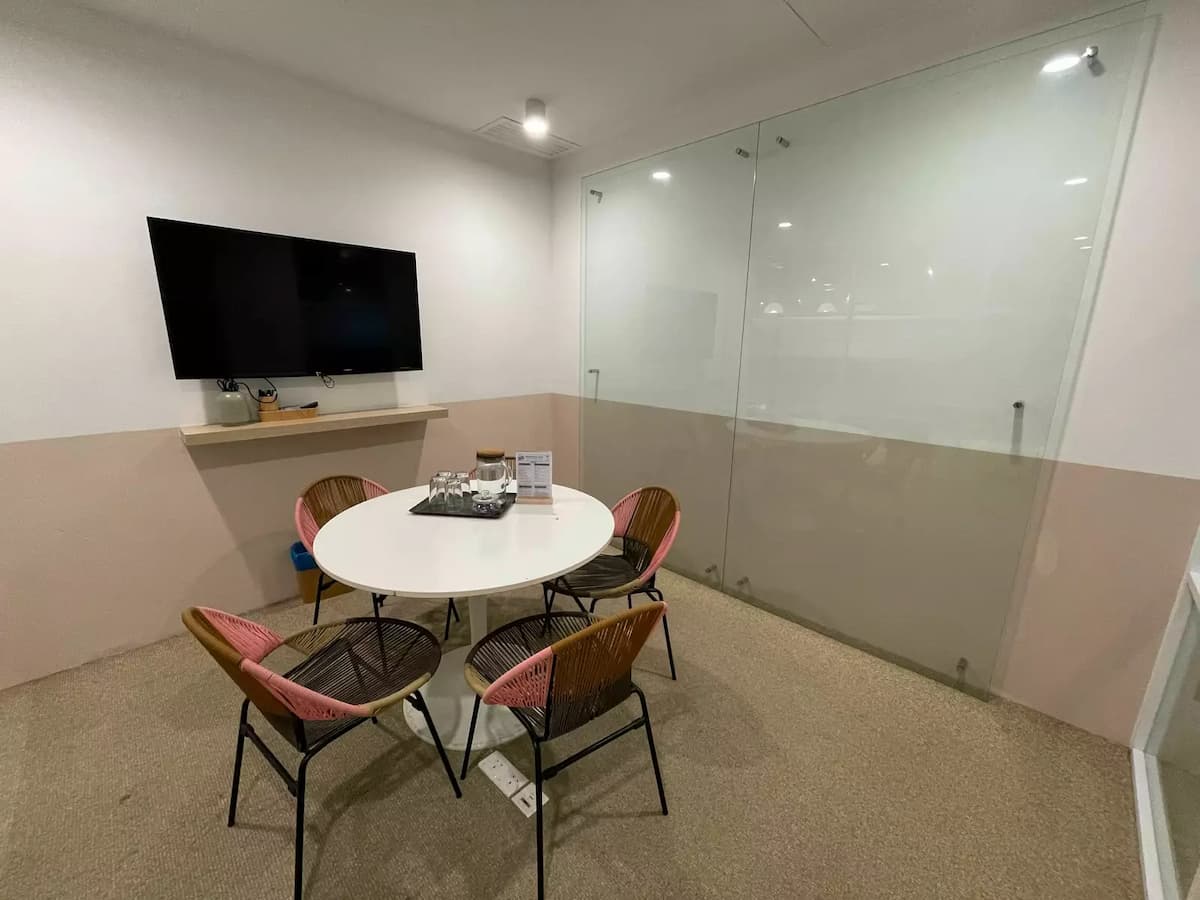 close-up of private meeting area for four with AV amenities