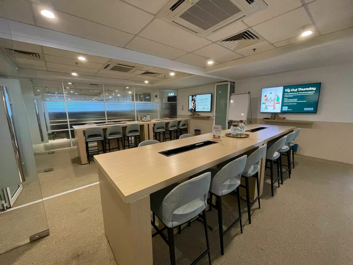 board room meeting area with TV equipment and a divider