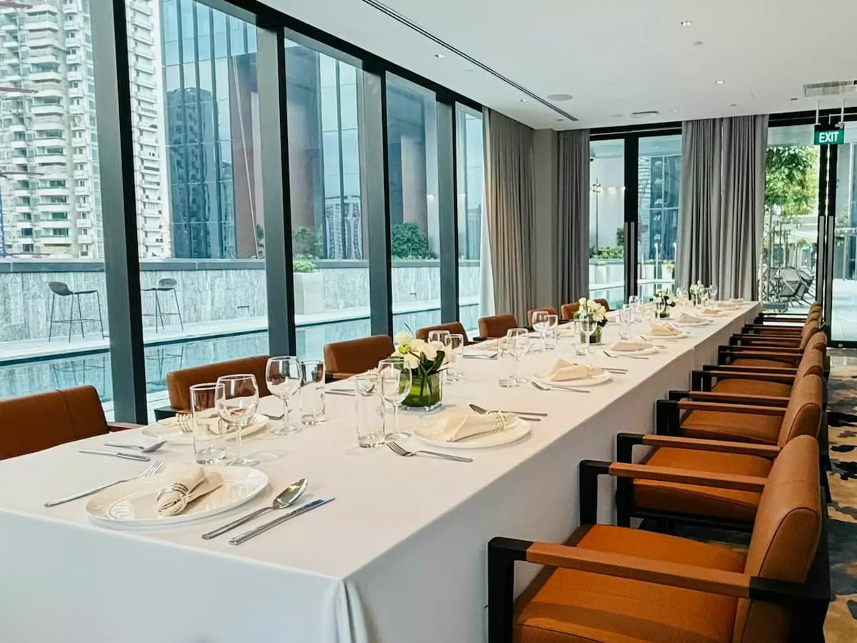 room with long table and simple table setup