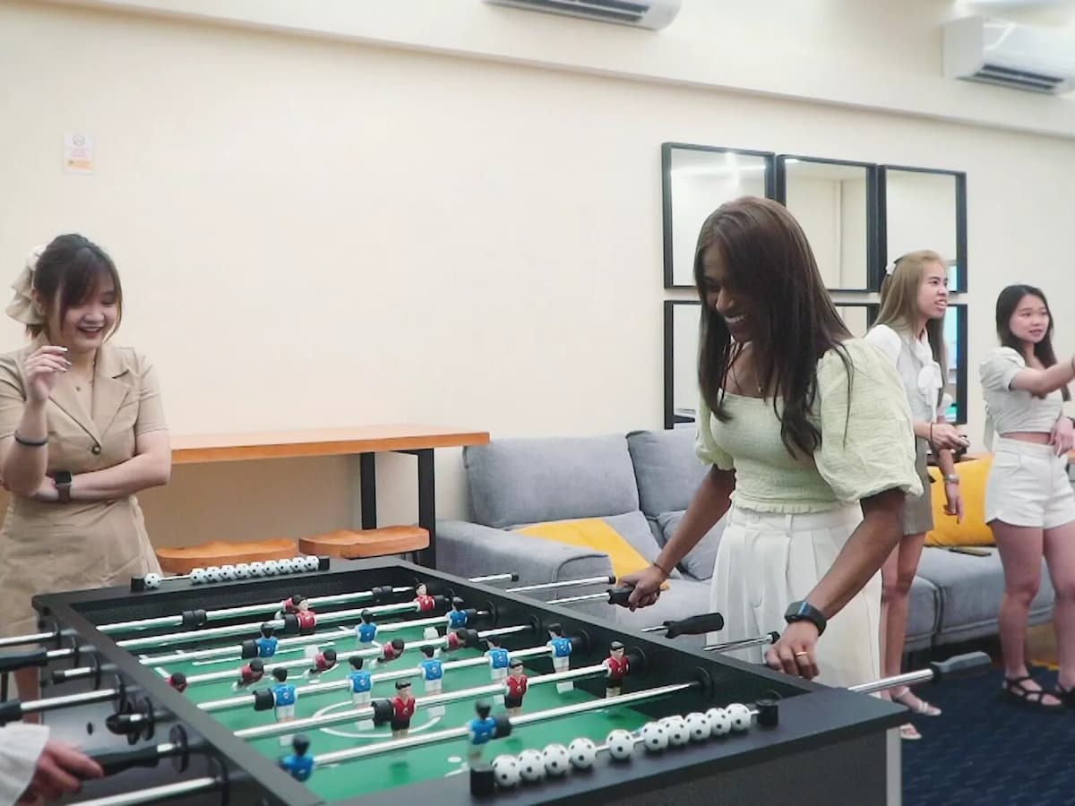 people playing foosball in celebration at highfive
