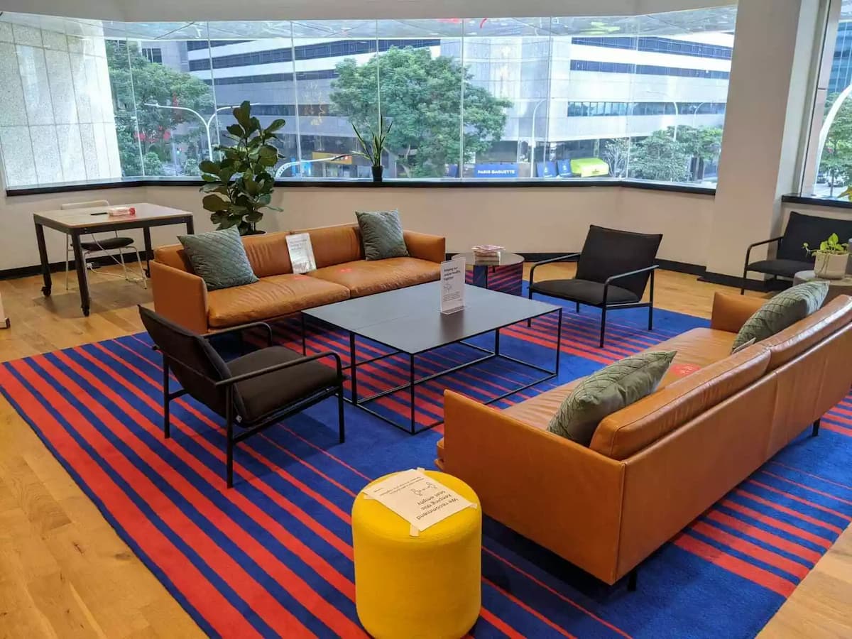 sofas in room with city view, retro carpet