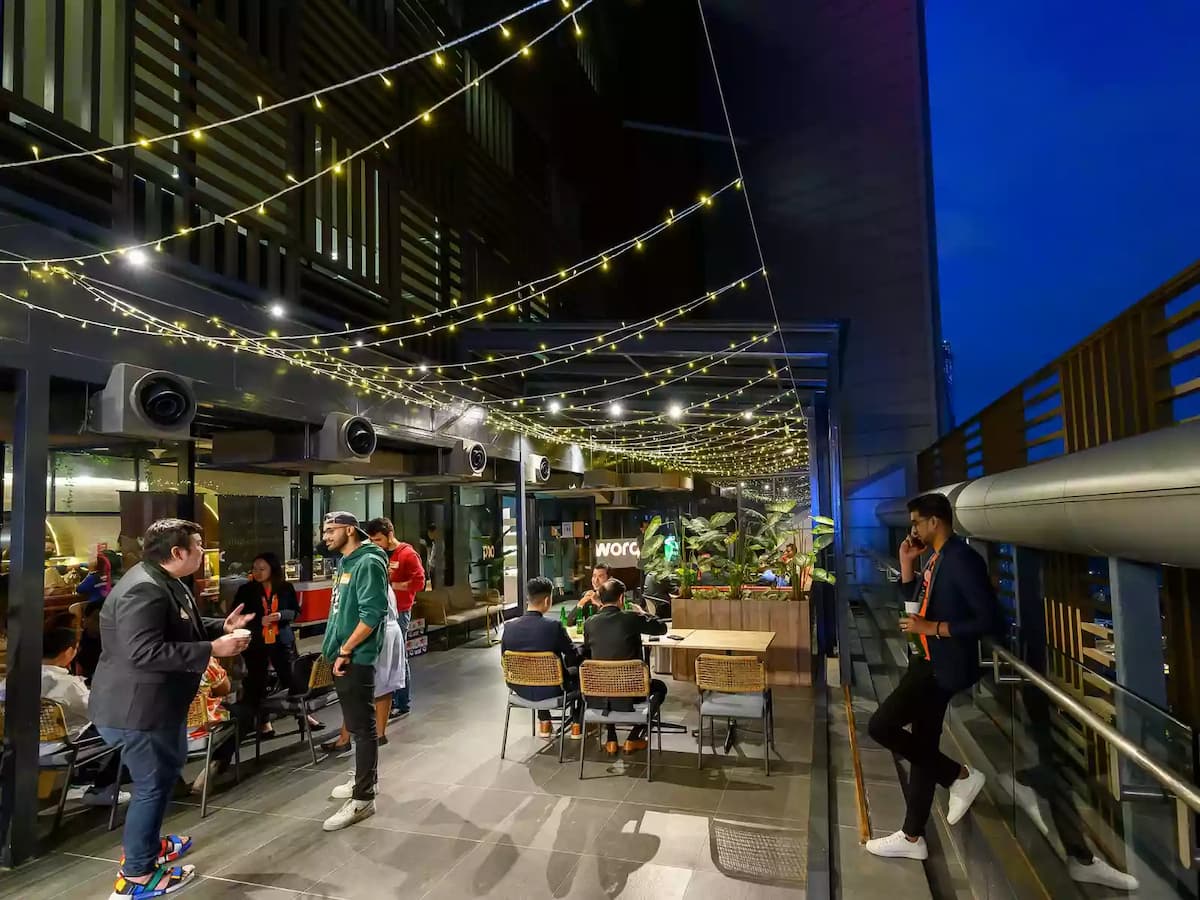 employee enjoying the ambiance of the event space with lights