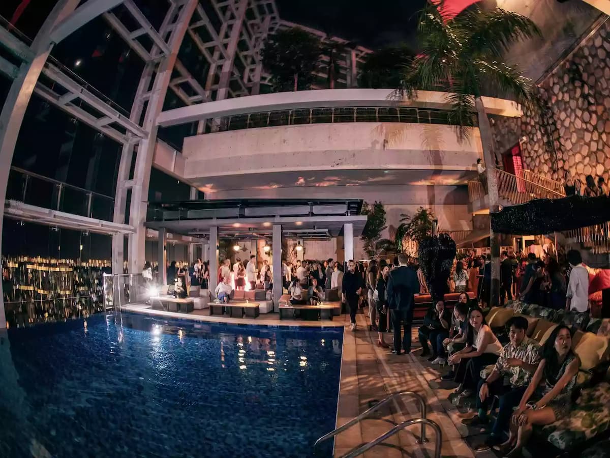 A vibrant sky pool party with a stylish crowd