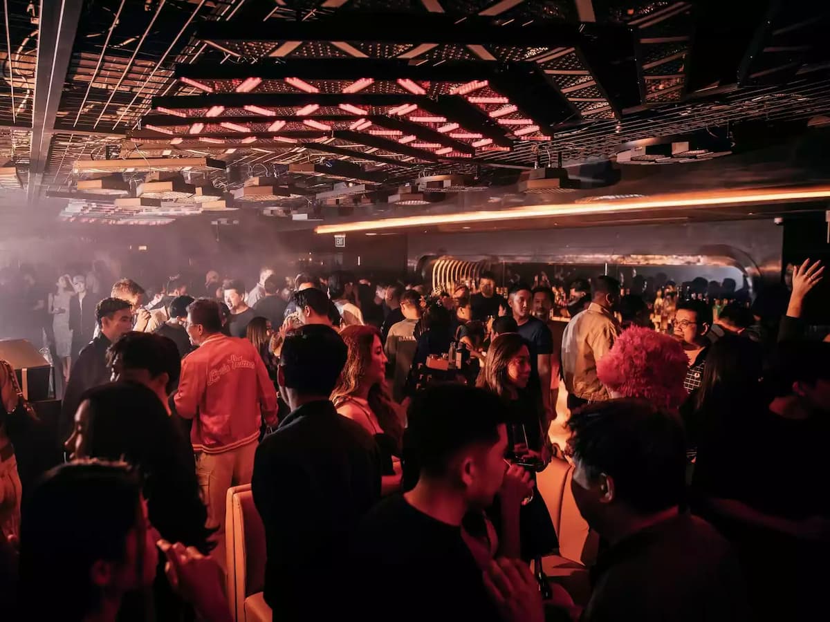 stylish crowd under dynamic lighting and an electrifying atmosphere