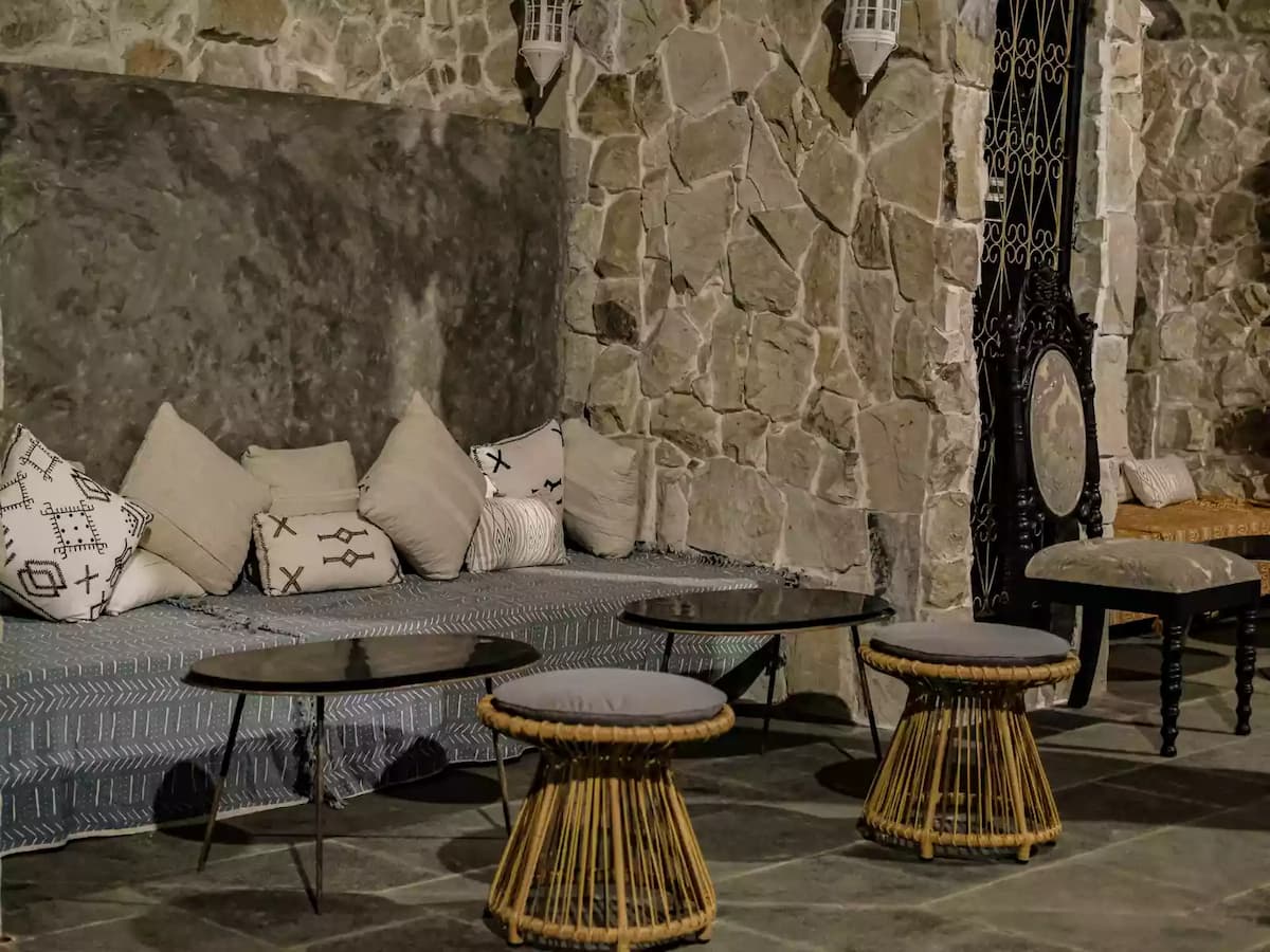 stone wall and a built-in cushioned bench
