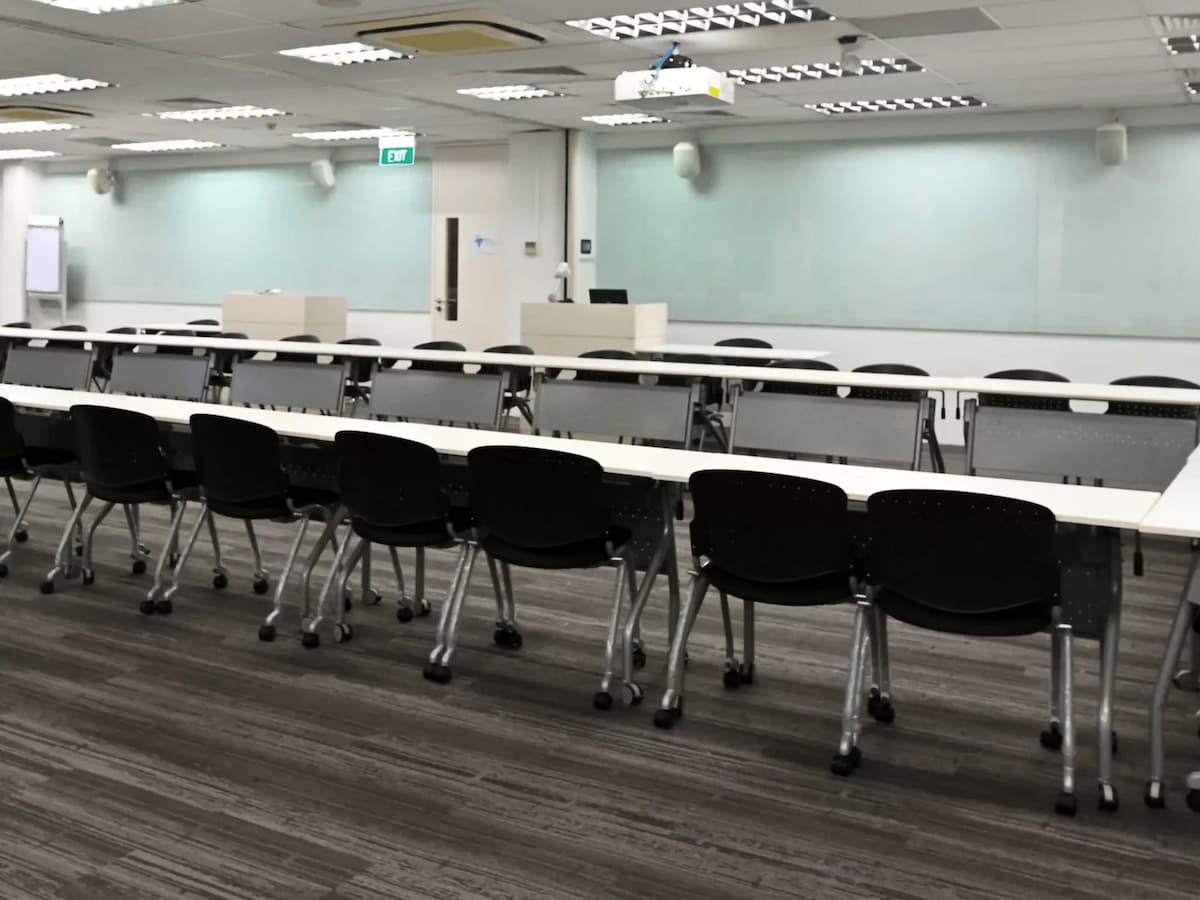 long tables with black chairs