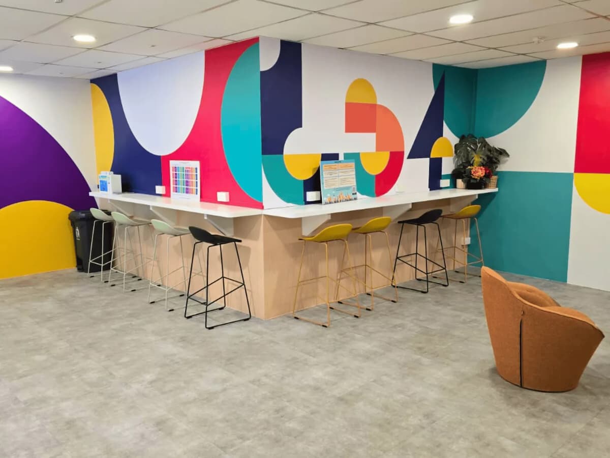 cozy area with seating and colorful wall