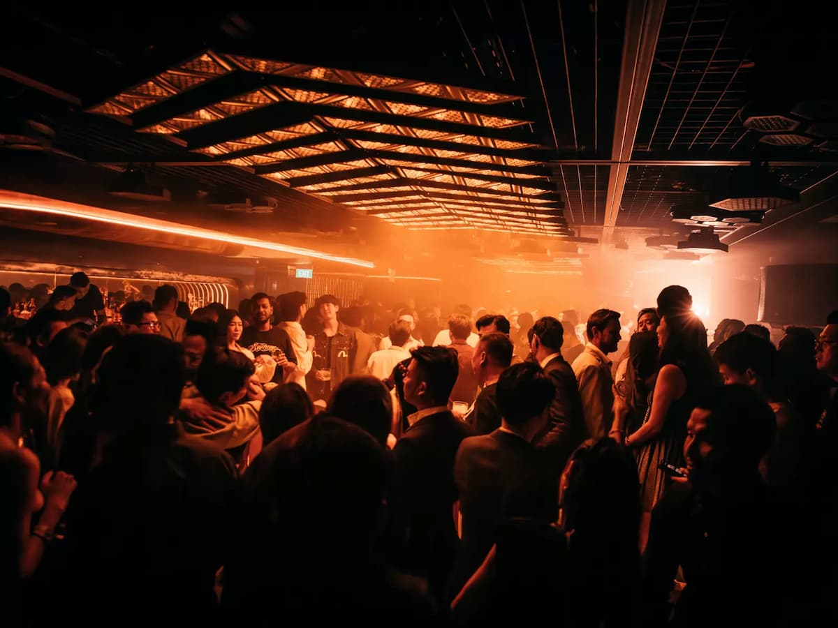 lively crowd under warm amber lighting and an energetic atmosphere