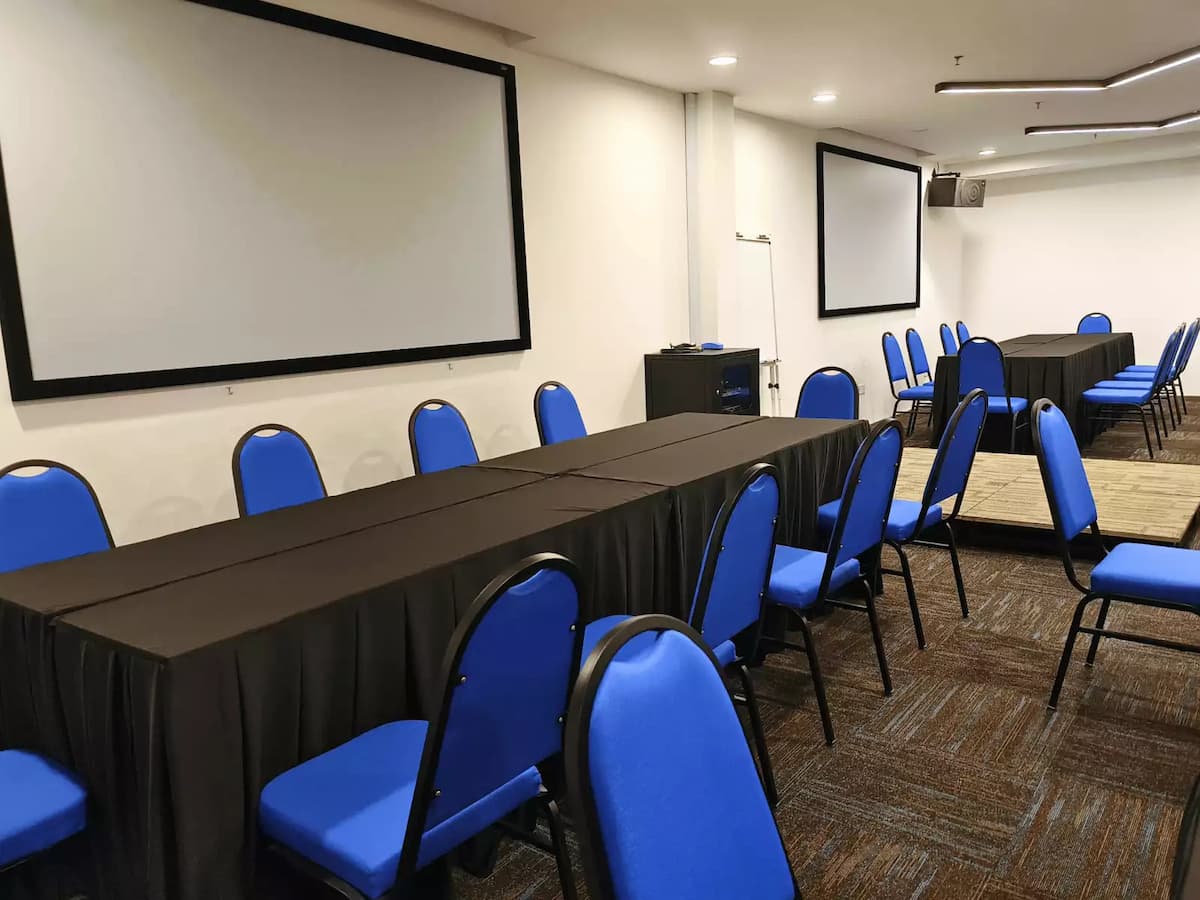 black long tables and blue chairs