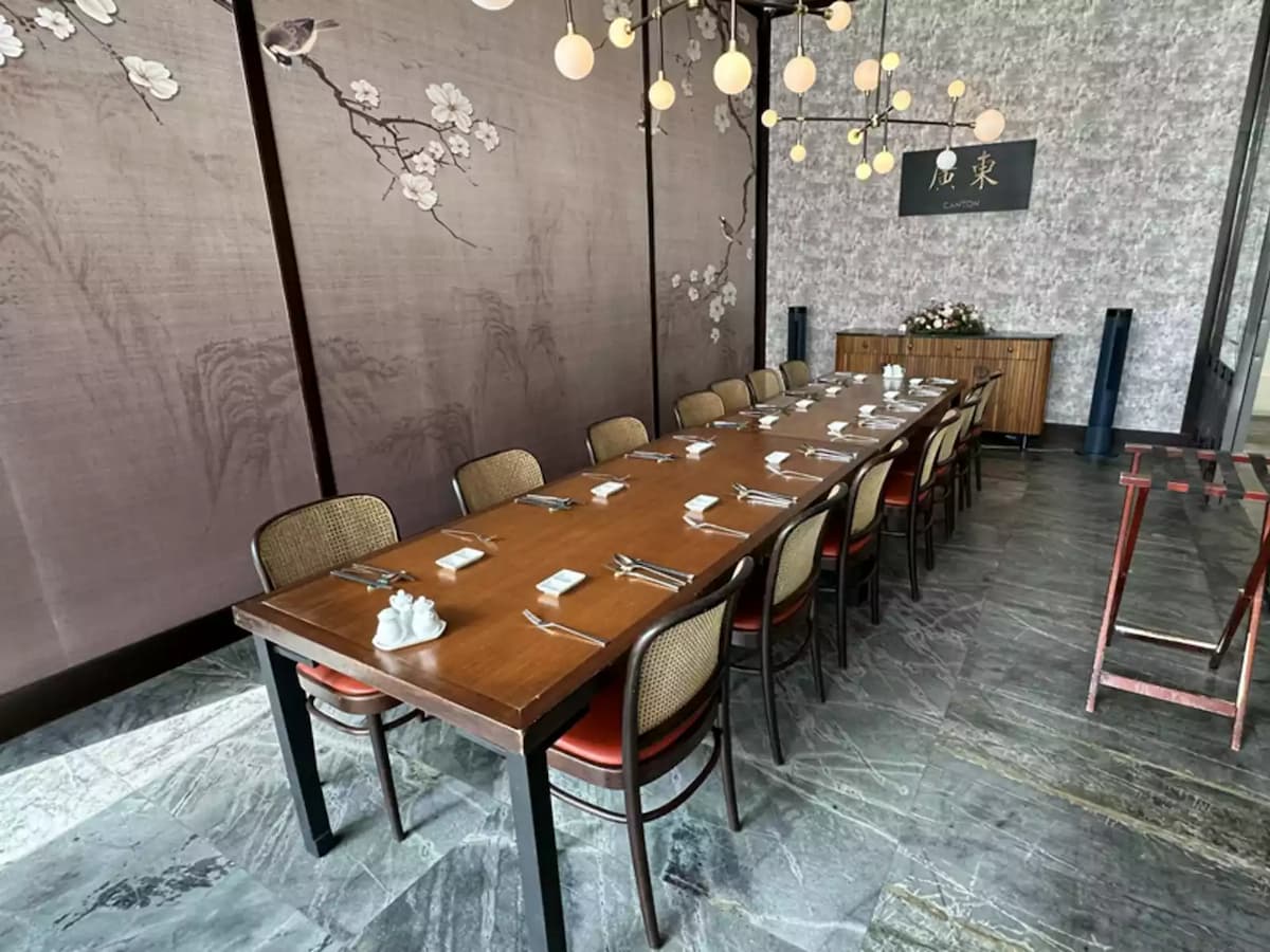 Private dining room with long table and contemporary Asian décor.