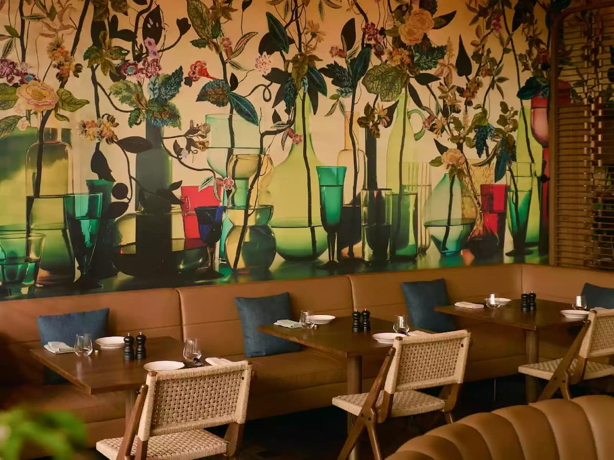 Artistic wallpaper dining area at Kaya at The Standard Singapore